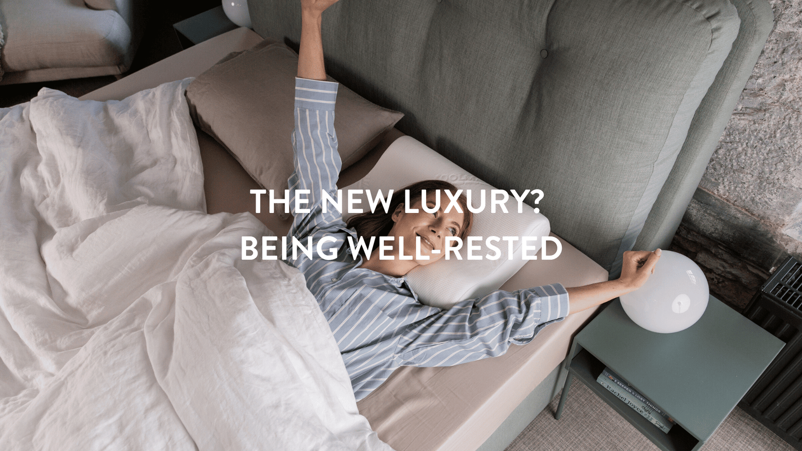 person waking up being well rested in a double bed