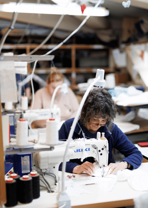 sewing machinists making pillows, bed wedges, mattresses in Devon factory.