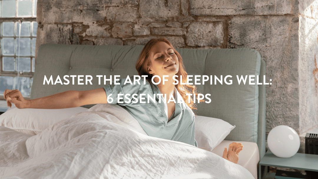 person waking up in bed an stretching with a teal headboard and white linen