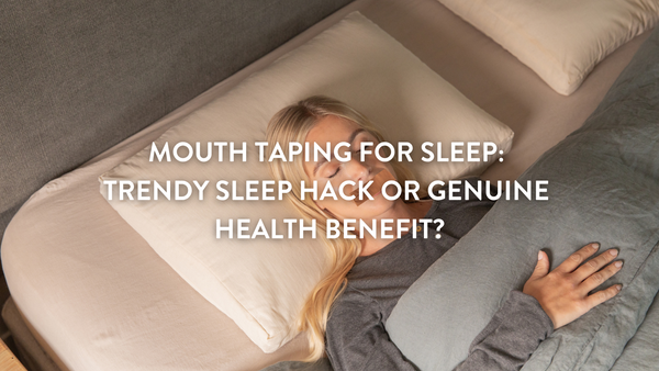 person sleeping in a bed wearing mouth tape 