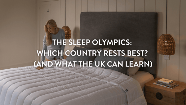 person making a large double bed with a crisp white Putnams duvet a pillow set