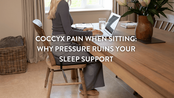 A person working from home at the kitchen table on a laptop using a Putnams Sitting Wedge