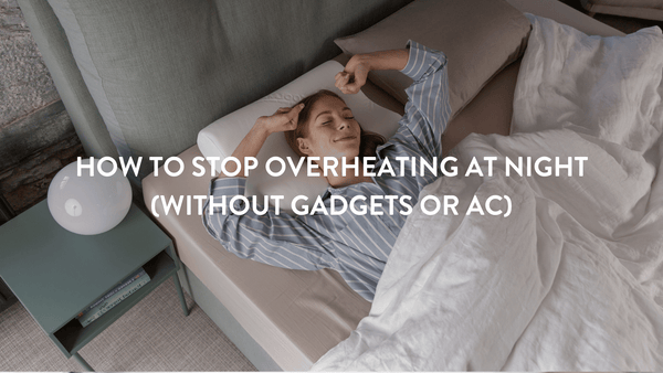 Person waking up in a double bed with white bed linen