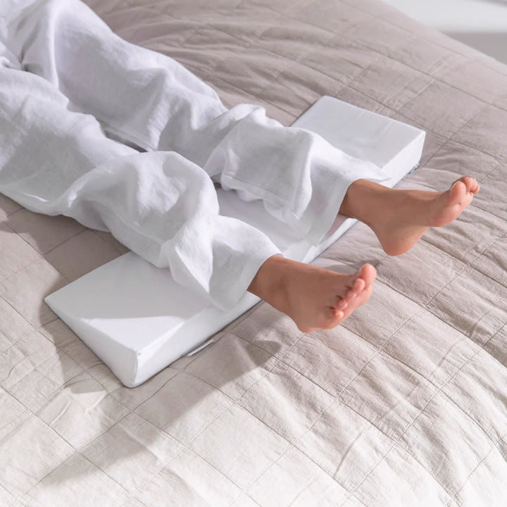 heel leg lift pillow to reduce pressure on heels sores bed triangle small putnams uk Cushion to lift heels off the bed to reduce pressure build up (formation of pressure sores, ulcers, & decubitus). Fitted, removable, washable cover. Handmade in the UK.