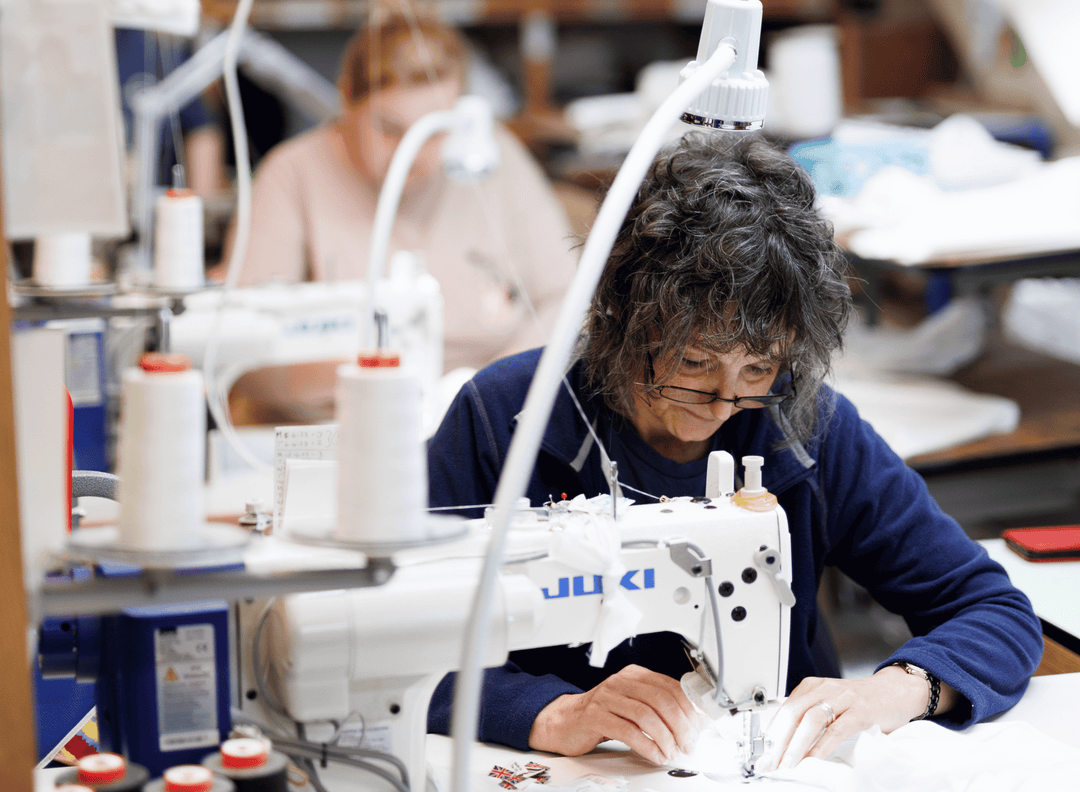 sewing machinists making pillows, bed wedges, mattresses in Devon factory. 